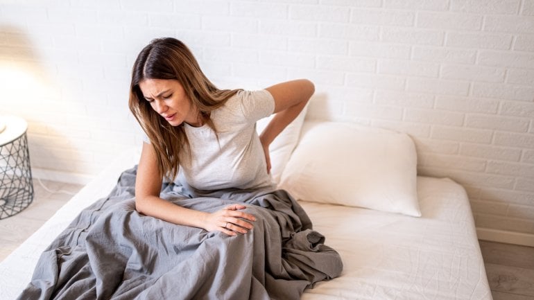Symptom der Eierstockzyste: Rückenschmerzen